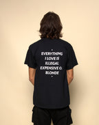 everything i love is illegal expensive or blonde t-shirt black. By FRASED. Unisex heavy cotton tee with a crew neckline and graphic screen print, made from 100% cotton, featuring a classic fit and tear-away label for comfort.