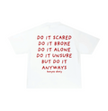White crew neck t-shirt with text 'DO IT SCARED DO IT BROKE DO IT ALONE DO IT UNSURE BUT DO IT ANYWAYS' in red on the back.